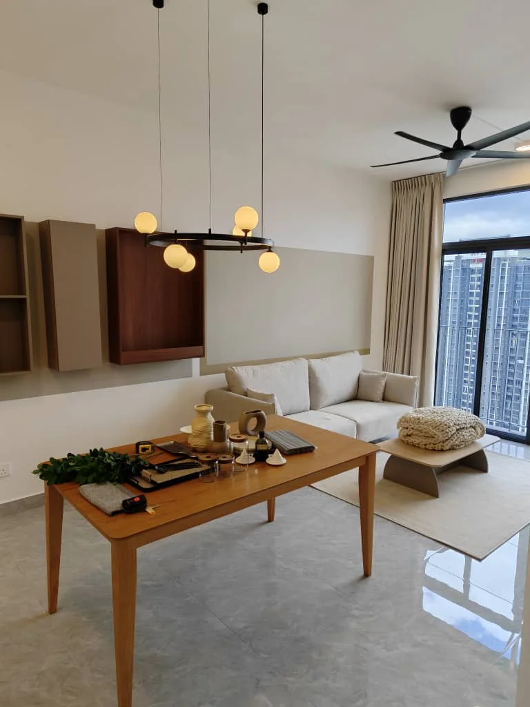 Living features: grey marble flooring, white painted walls, large floor-to-ceiling windows, beige curtains, 3-blade ceiling fan, modern pendant light with multiple bulbs, light wood dining table, beige upholstered sofa, decorative throw pillow, decorative rug, wall-mounted shelving unit, greenery decor; style: modern; view: city.